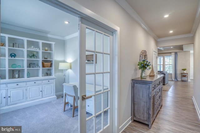 interior space with ornamental molding, recessed lighting, light wood-style flooring, and baseboards