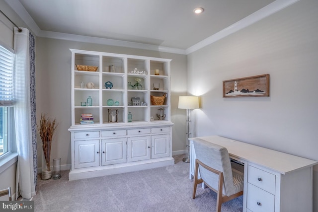 office space featuring baseboards, crown molding, and light colored carpet