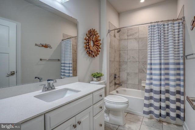 full bath featuring shower / bath combination with curtain, tile patterned flooring, vanity, and toilet