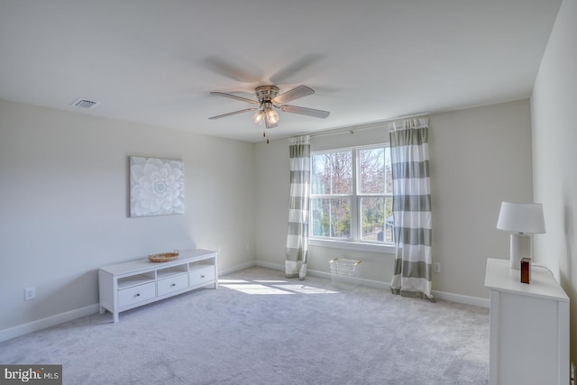 unfurnished room with baseboards, visible vents, ceiling fan, and carpet flooring