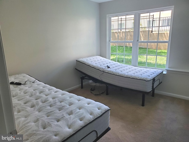 carpeted bedroom with baseboards