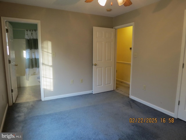 unfurnished bedroom with carpet, baseboards, a ceiling fan, and ensuite bathroom