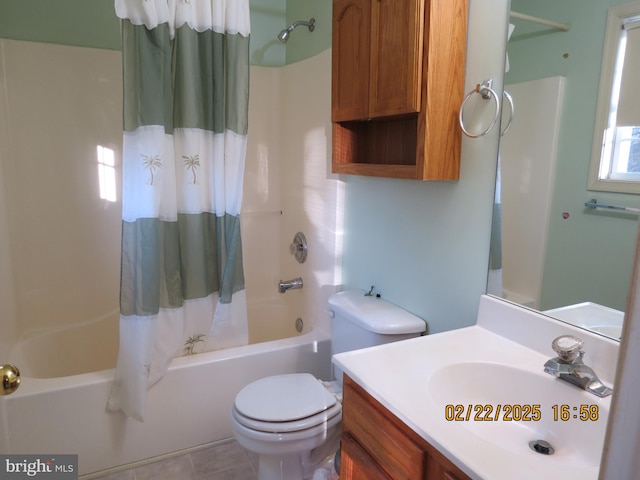 bathroom with toilet, shower / tub combo with curtain, and vanity