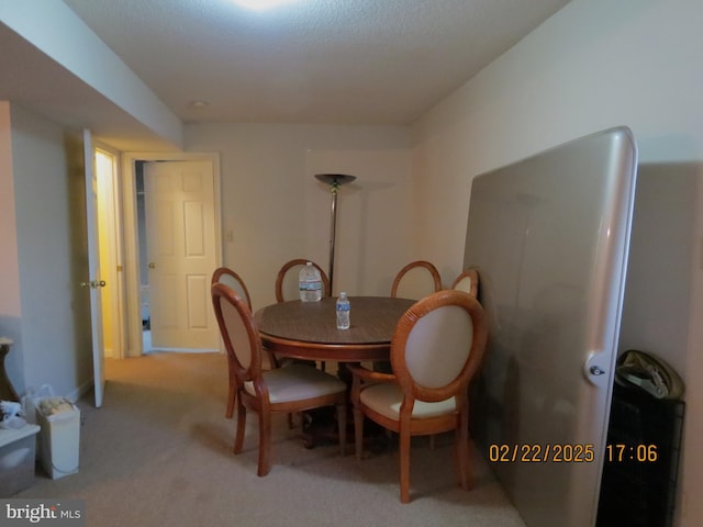 view of carpeted dining area