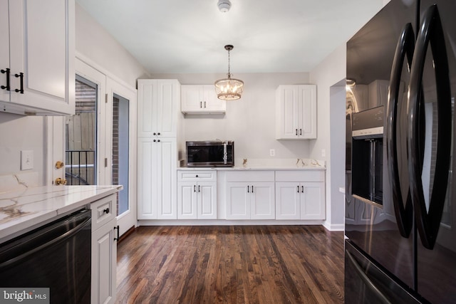 kitchen featuring dishwashing machine, stainless steel microwave, black refrigerator with ice dispenser, and dark wood finished floors