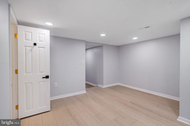 finished below grade area with baseboards, visible vents, wood finished floors, and recessed lighting