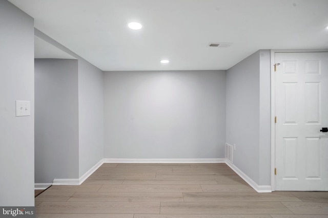 interior space with recessed lighting, visible vents, baseboards, and wood finished floors