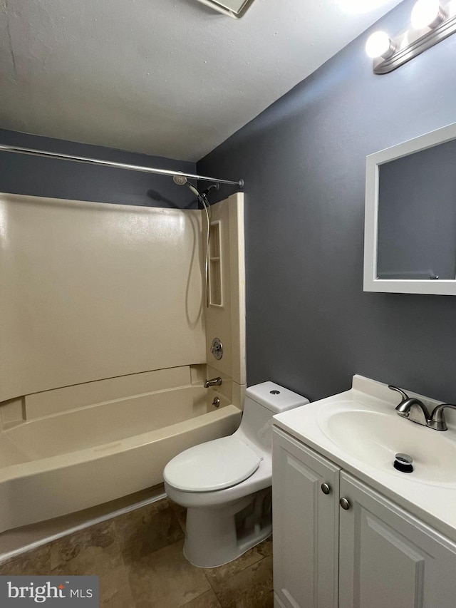 bathroom featuring shower / washtub combination, vanity, and toilet