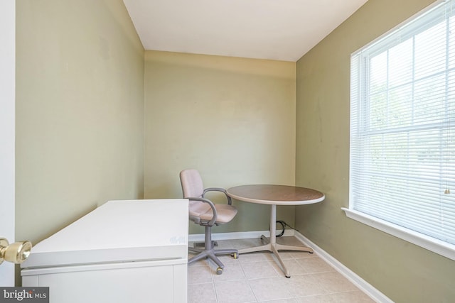 office area with baseboards and light tile patterned flooring