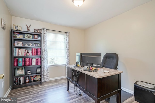 office featuring wood finished floors and baseboards