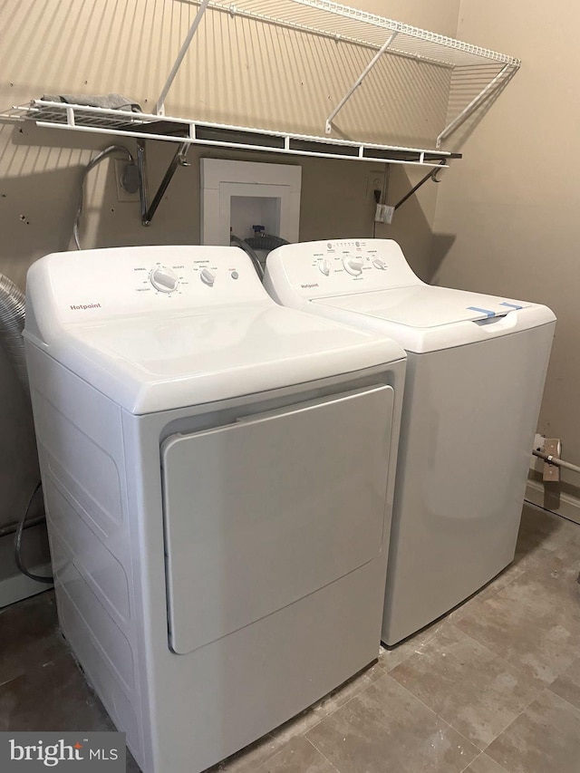 washroom featuring laundry area and washer and dryer