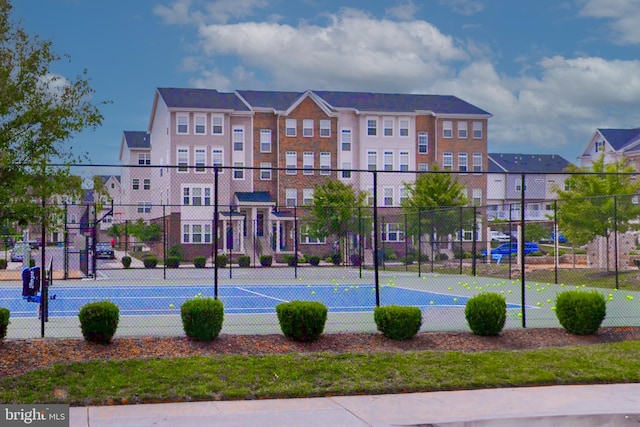 view of sport court with fence