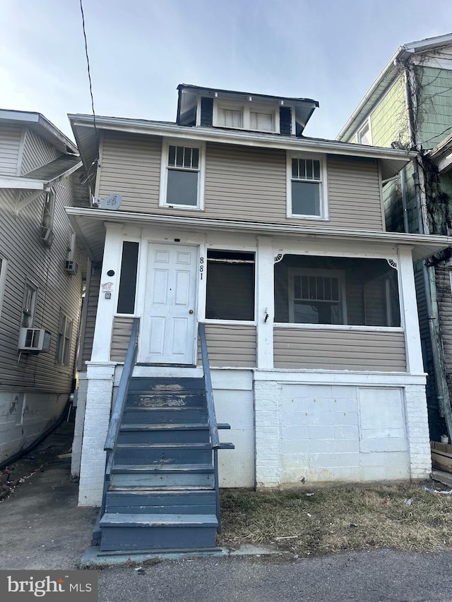 american foursquare style home featuring cooling unit