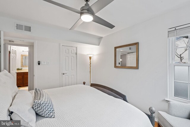 bedroom with ceiling fan and visible vents