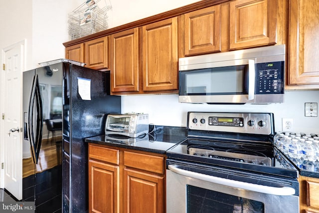 kitchen with stainless steel appliances and brown cabinets