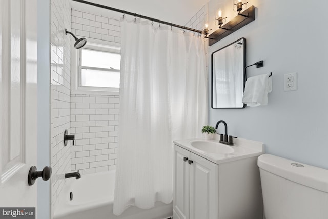 bathroom with vanity, toilet, and shower / bathtub combination with curtain