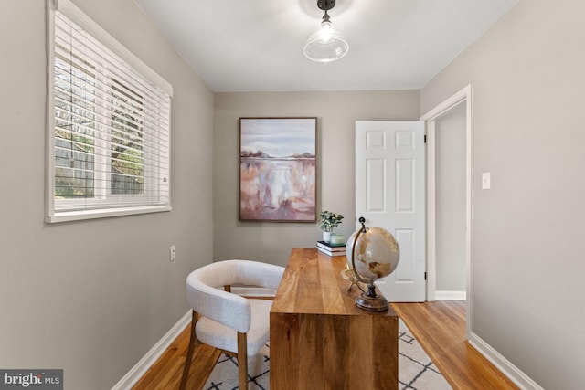 home office featuring light wood-style floors and baseboards