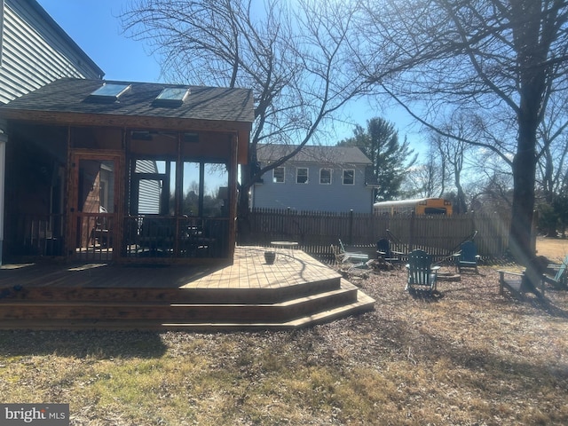 view of yard with fence and a deck