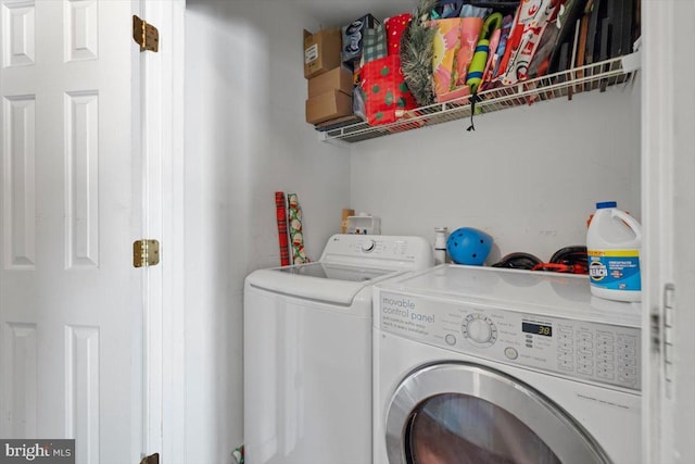 washroom featuring laundry area and washer and clothes dryer