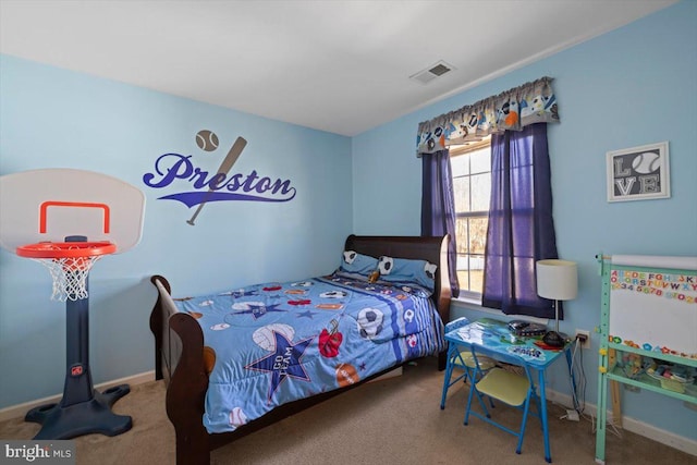 carpeted bedroom featuring visible vents and baseboards