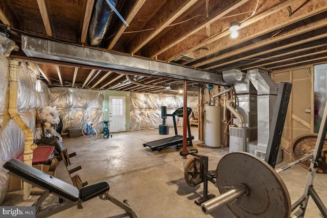 exercise area featuring water heater and heating unit