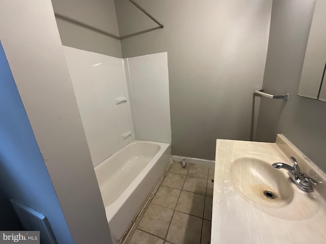 bathroom with tile patterned flooring, vanity, shower / bath combination, and baseboards