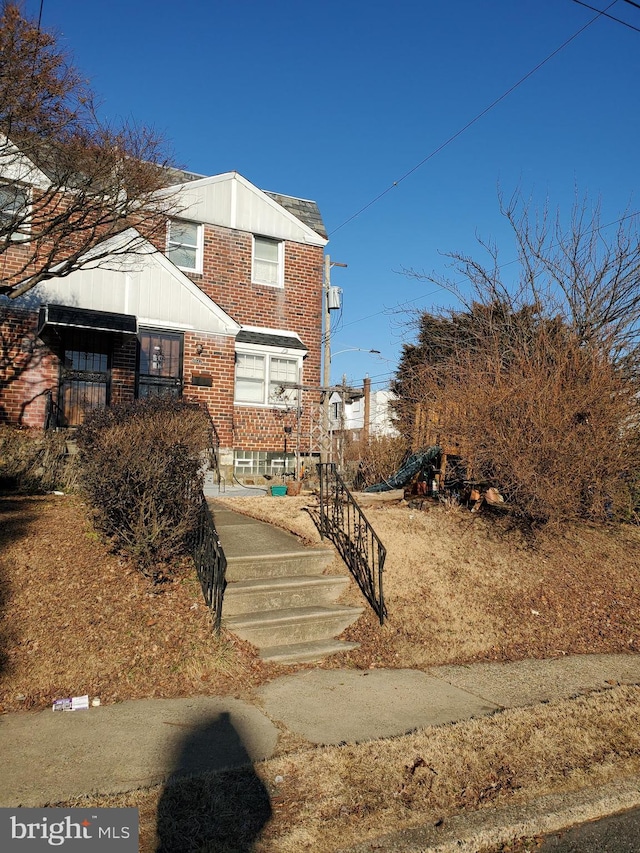 view of front of property featuring brick siding