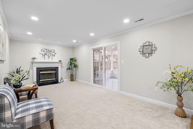 living area with recessed lighting, a fireplace with flush hearth, baseboards, ornamental molding, and carpet