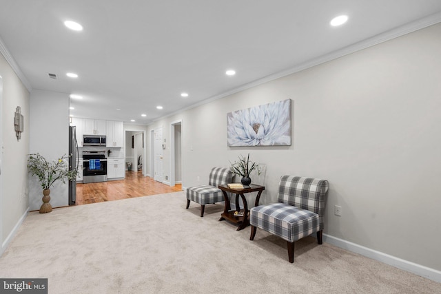 living area with light carpet, recessed lighting, and crown molding