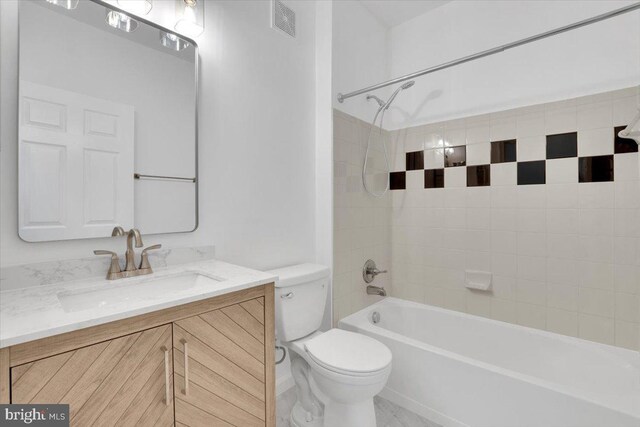 11379 Aristotle Dr Unit 10-409, Fairfax, VA 22030 - bathroom featuring toilet, vanity, and shower / bath combination
