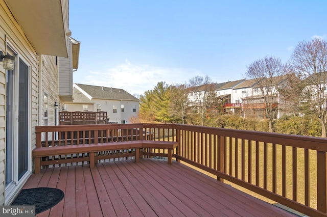 wooden terrace featuring a residential view