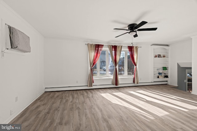 unfurnished living room featuring ceiling fan, ornamental molding, baseboard heating, and wood finished floors