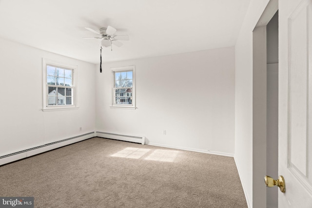 unfurnished room with a ceiling fan, carpet, and a baseboard heating unit