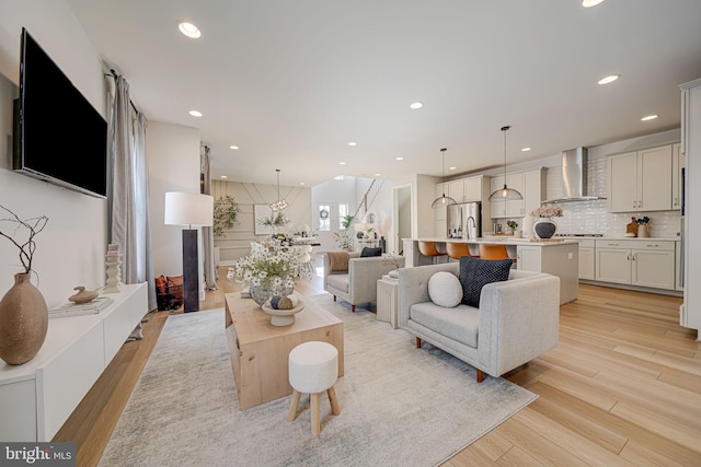 living room featuring light wood-style floors and recessed lighting