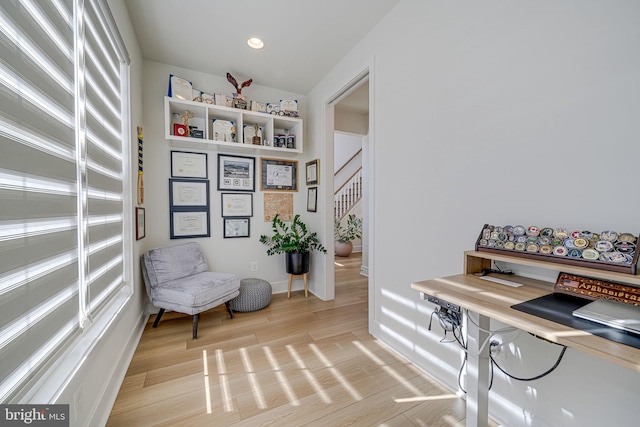 living area featuring stairs, light wood-type flooring, baseboards, and recessed lighting