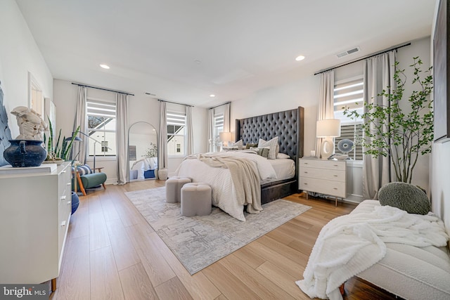 bedroom featuring recessed lighting, visible vents, and light wood-style flooring