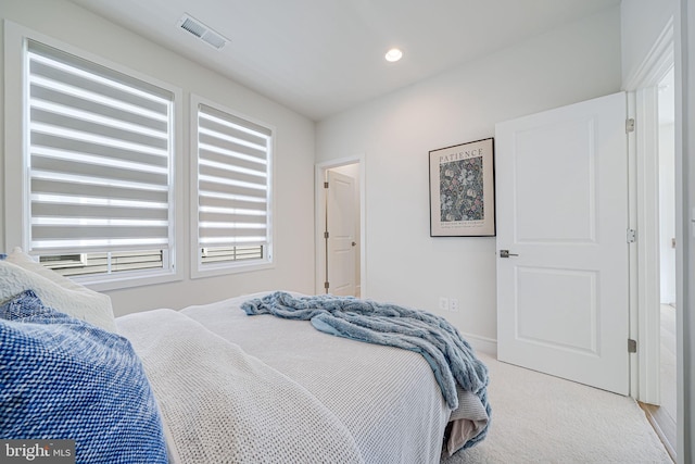 bedroom featuring recessed lighting, visible vents, and light carpet