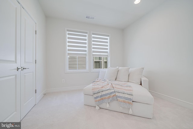 carpeted bedroom featuring visible vents and baseboards