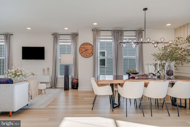 dining area with recessed lighting and wood finished floors