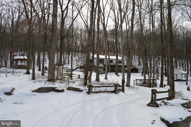 view of property's community featuring a wooden deck and a garage