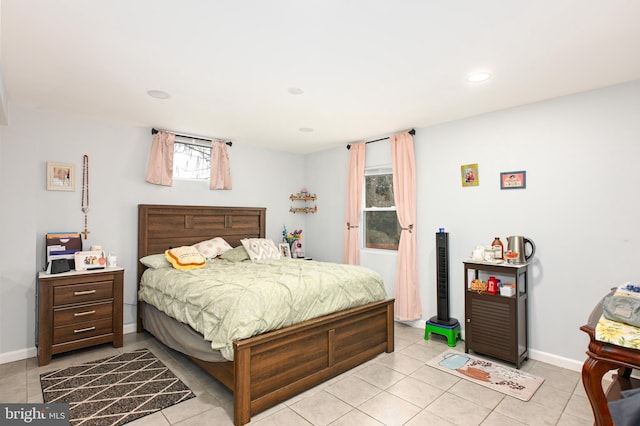 bedroom featuring recessed lighting, baseboards, and light tile patterned floors