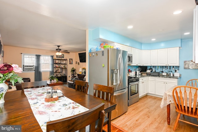 kitchen featuring recessed lighting, appliances with stainless steel finishes, white cabinets, ceiling fan, and light wood-type flooring