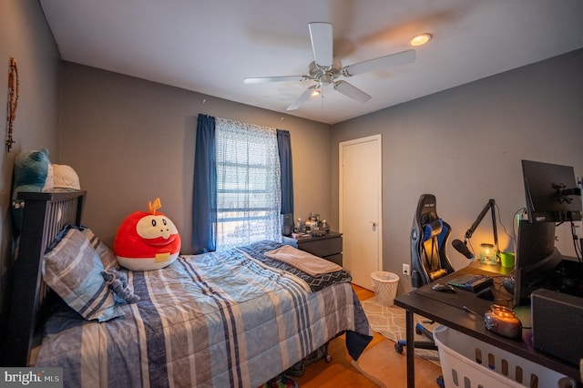 bedroom featuring a ceiling fan and wood finished floors