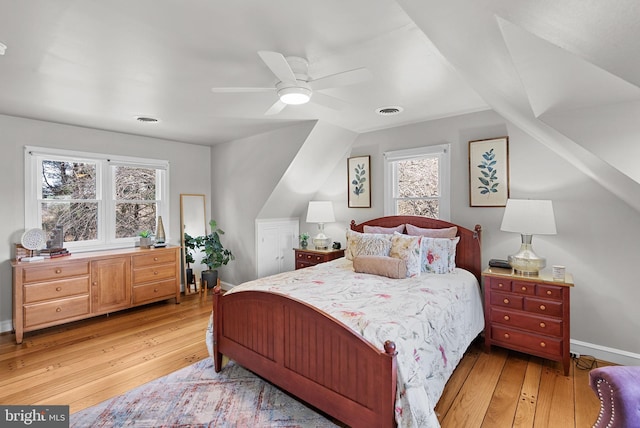 bedroom with visible vents, baseboards, and light wood-style floors