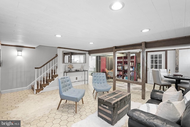 living room featuring recessed lighting, stairs, and baseboards