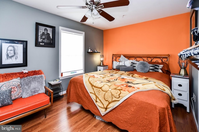 bedroom featuring wood finished floors and a ceiling fan