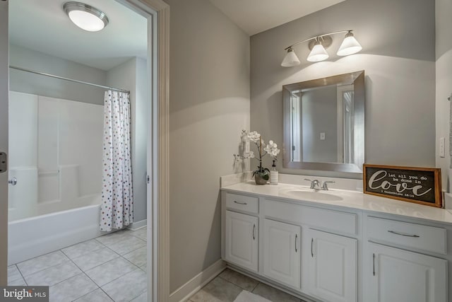 bathroom with shower / tub combo with curtain, vanity, and tile patterned floors