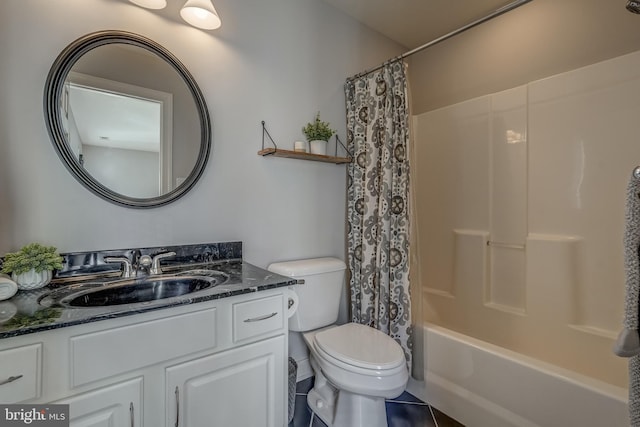 bathroom with shower / tub combo, vanity, and toilet