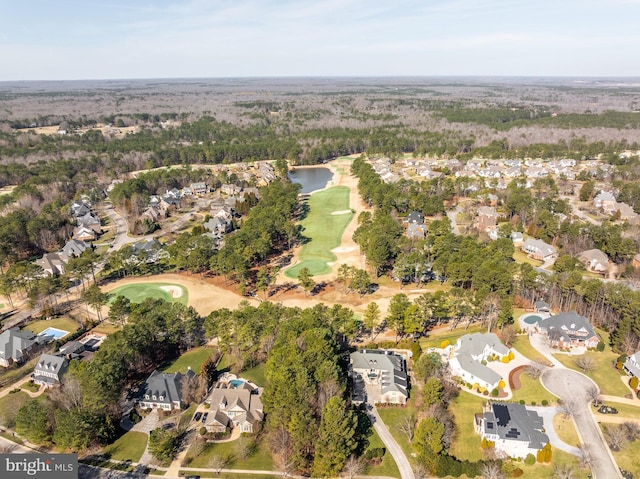 drone / aerial view with a water view, a residential view, and golf course view