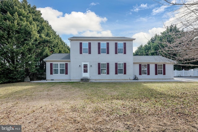 colonial-style house with a patio, a front yard, crawl space, entry steps, and fence